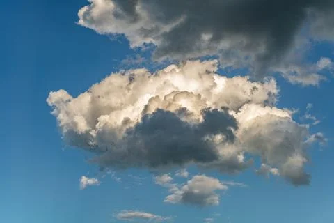 Towering Cumulus Clouds with Dramatic Light and Shadow Stock Photos