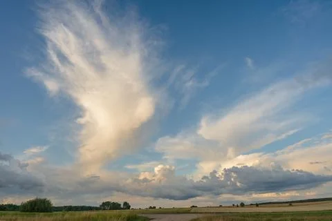 Towering Cumulus Clouds Over a Summer Countryside Landscape Stock Photos