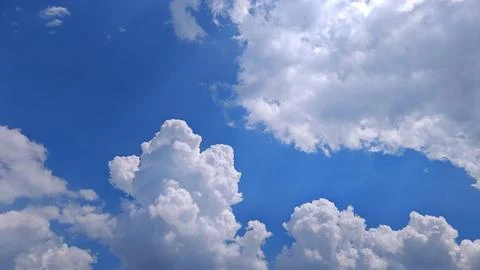 Towering Cumulus Clouds Under Bright Sky 스톡 사진