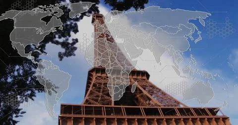 Towering Eiffel Tower climbing toward sky at Paris base, with world map overlay Stock Photos