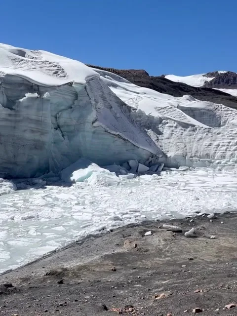 Towering Glacial Ice Wall and Frozen Lake in Peru Stock Footage 339584113