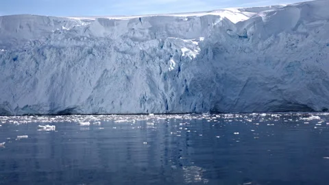 Towering Glacier Front Surrounded by Floating Ice 動画素材 343373471