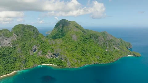 The towering green mountains hug the pristine coastline. Philippines. Stock Footage 302699152