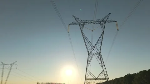 Towering high voltage power line structure with radiating cables against Stock Footage 313280238