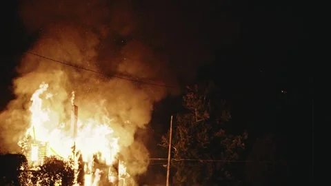 Towering House Fire Sends Thick Smoke Into the Night Sky Stock Footage 313269676