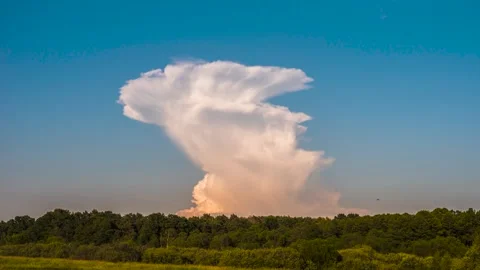The towering of an isolated thunderstorm cell during sunset, Timelapse Stock Footage 301408098