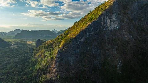 Towering Mountain Cliff Touching the Sky Stock-Fotos