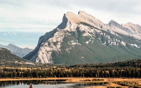 Towering Mountain Peak with Lake Reflection Stock Photos