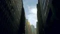 Towering NYC skyscrapers against blue sky, low angle view 4k or 4k+ Resolution