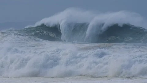 Towering Ocean Waves Collapsing with Intense Force During a Storm Stock Footage 297511407