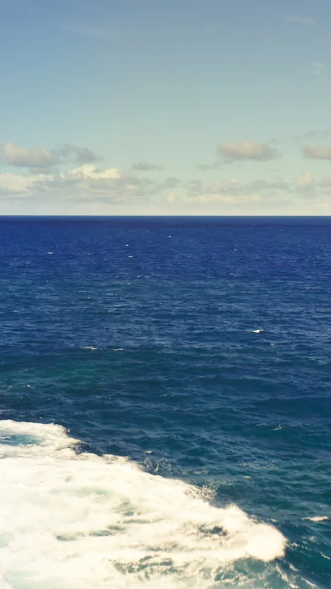 Towering ocean waves crashing through volcanic rock formations — dramatic Stock Footage 320991321