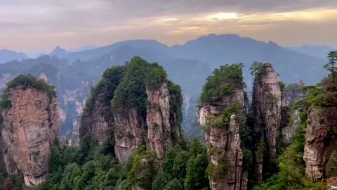 Towering quartz‑sandstone pillars rise dramatically in Yuanjiajie, Stock Footage 342912263