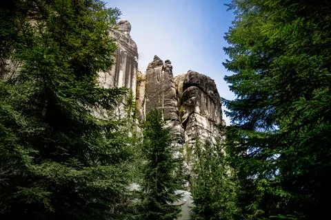 Towering Rock Formation Surrounded by Trees Stock Photos