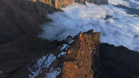 Towering Roque de los Muchachos peak piercing dense cloud layer, scenic aerial 스톡 동영상 308586667