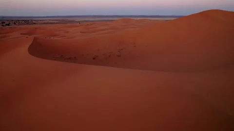 Towering sand dune overlooking the Erg Chebbi dune sea near Merzouga Morocco Stock Footage 338168807