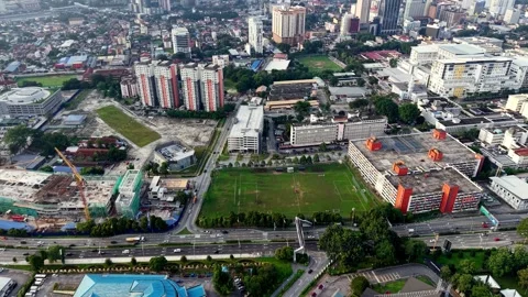Towering skyscrapers pierce the skyline in a dramatic overhead view. 動画素材 318096936