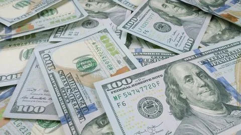 A Towering Stack of Newly Printed Dollar Bills Ready for Use in Transactions and Stock Photos