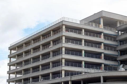 A towering structure with ample parking spots near it Stock Photos