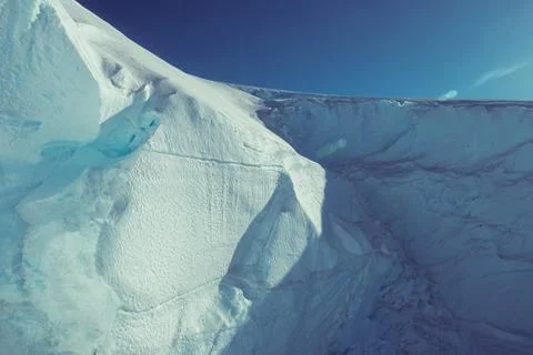 Towering vertical icebergs drifting in the icy waters of Antarctica. Stock Photos