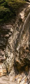 Towering waterfall cascading down dramatic rock formations in Taroko Nation.. Stock Photos