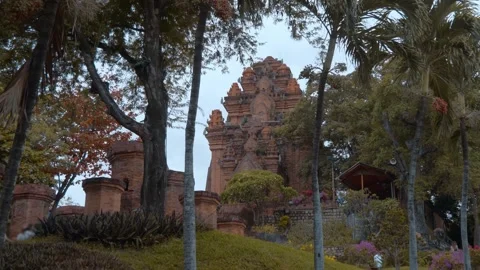 Towers made of reddish fired bricks with intricate tiered roofs, stone sculpture Stock Footage 340564796