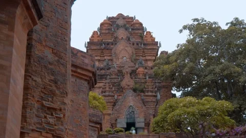 Towers made of reddish fired bricks with intricate tiered roofs, stone sculpture Stock Footage 340625039