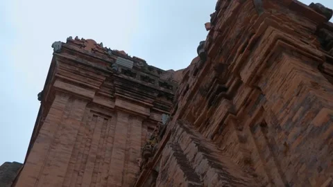 Towers made of reddish fired bricks with intricate tiered roofs, stone sculpture Stock Footage 340628654
