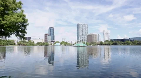 Towers reflection in Lake Eola Park, Downtown Orlando Stock Footage 66203142