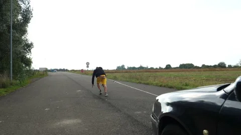 Towing a car with a rope 库存影片 145641005