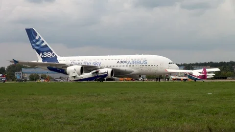 Towing four-engine wide-body two-story passenger aircraft Airbus A-380. Stock Footage 118647594