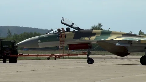 Towing multipurpose Su-35 in static parking lot. Close-up. Stock Footage 107173799