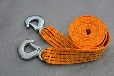 Towing strap on a grey background. Stock Photos