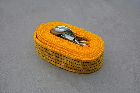 Towing strap on a grey background. Stock Photos