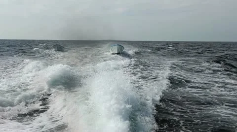 Towing two small boats behind larger cruise party boat Pacific HD 0693 Stock Footage 12582716
