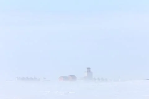 Town and Grain Elevator in Blizzard Saskatchewan Stock Photos