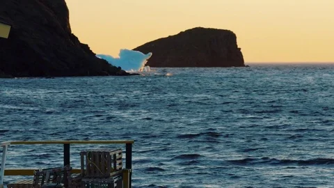 Town and ocean harbor with iceberg at twillingate newfoundland Stock Footage