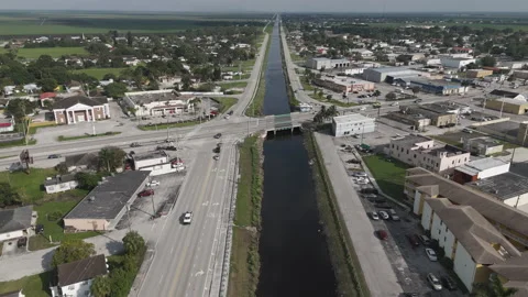 Town And Water Channel. Aerial. Stock Footage 322024913