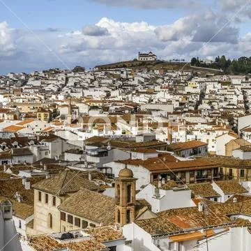 The town of Antequera with a church on a hilltop in the distance Stock Photos