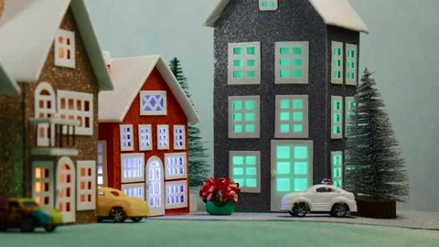 A town of big and small cute houses with colorful cars nearby Stock Footage 266927780