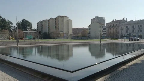 Town center reflected in a pool mirror. metropolitan city of Milan,Lombardy, Stock Footage 151053729