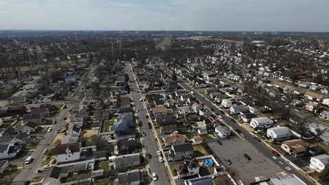 Town fly-down shot in early spring Stock Footage 305275857