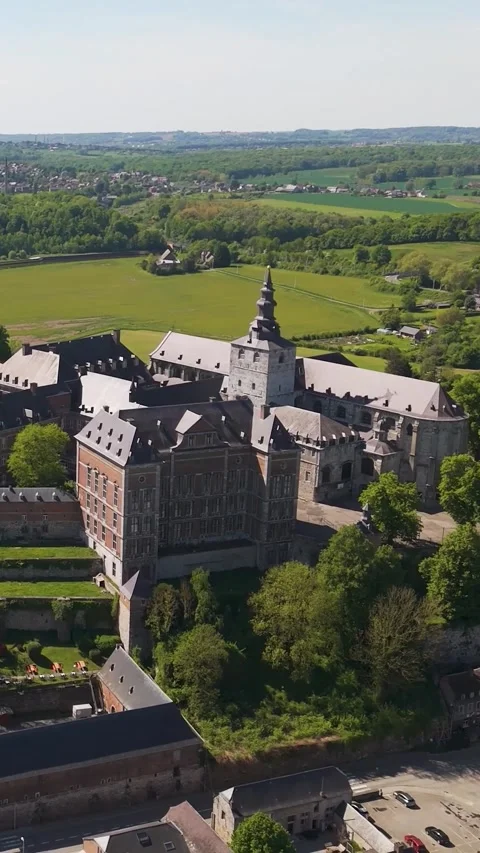 Town green fields distant windmills floreffe abbey belgium area's agricultural Vidéo 321240609