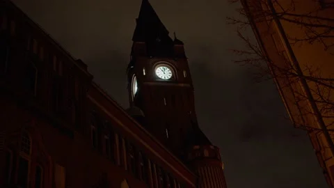 Town Hall Clock at Night with Clouds moving in the Background Stock Footage 169487997