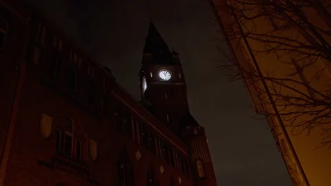 Town Hall Clock at Night with Clouds moving in the Background Stock Footage 169490043