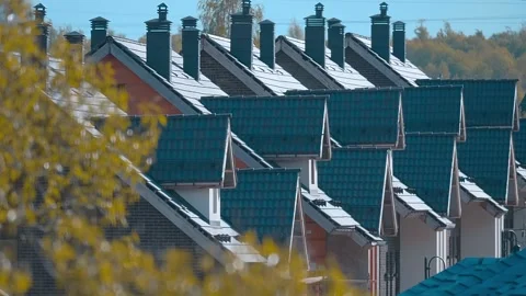 The town has rows of identical cottage roofs and ventilation pipes  Stock Footage 313232508