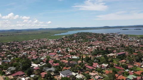 Town to Lakeside: A Drone's Smooth Journey 스톡 동영상 278729872