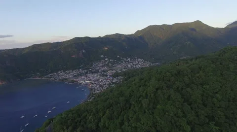 Town in Malta bay at sunset, surrounded by forest Stock Footage 66340603