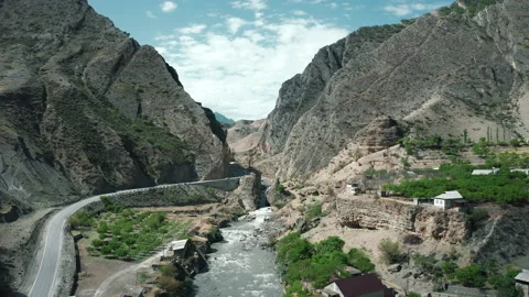 Town in a mountain valley Stock Footage 165564390