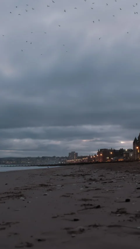 Town night lights and cloudy sunrise at Portobello Beach in Edinburgh Stock Footage 325850497