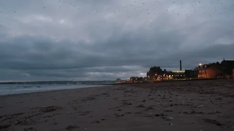 Town night lights and cloudy sunrise at Portobello Beach in Edinburgh Stock Footage 325853464